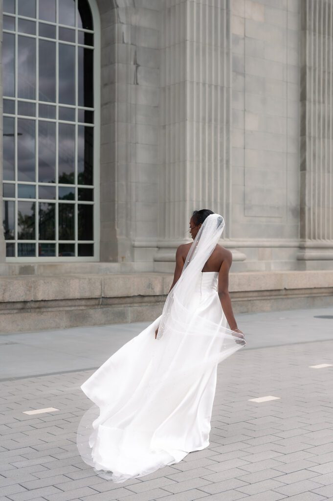 Bride posing at Michigan Central Train Station wedding portraits
