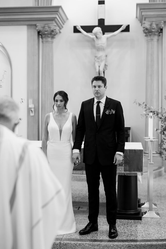 Bride and grooms Grand Rapids Wedding Ceremony at Our Lady Seat of Wisdom Chapel on Aquinis College