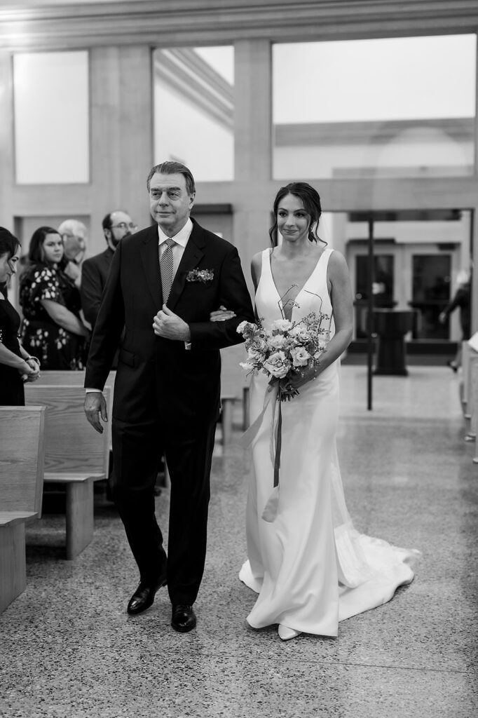 Bride walking down the aisle with her father