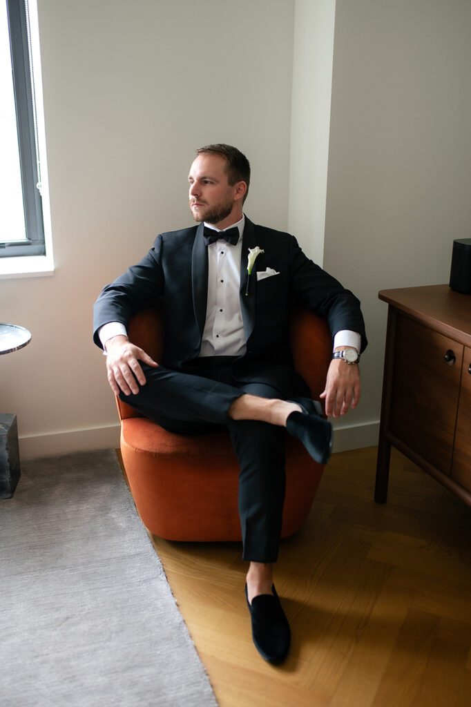 Indoor grooms portraits from a Book Tower wedding in Detroit, Michigan