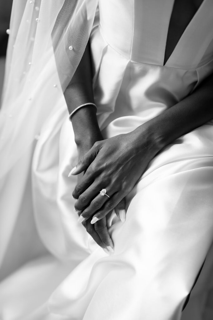 Black and white photo of a brides wedding attire and details