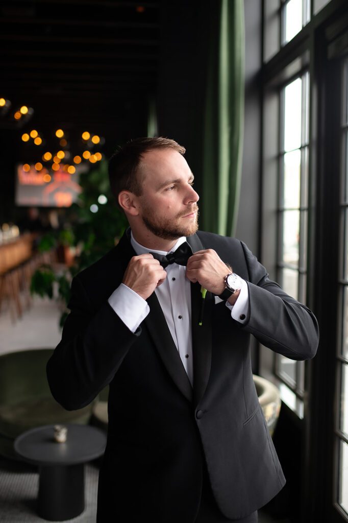 Indoor grooms portraits from a Book Tower wedding in Detroit, Michigan
