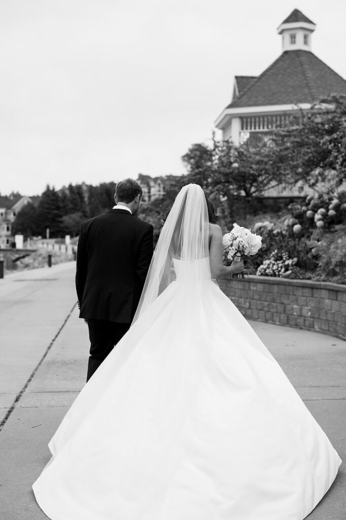Bride and groom walking away together after the ceremony as husband and wife