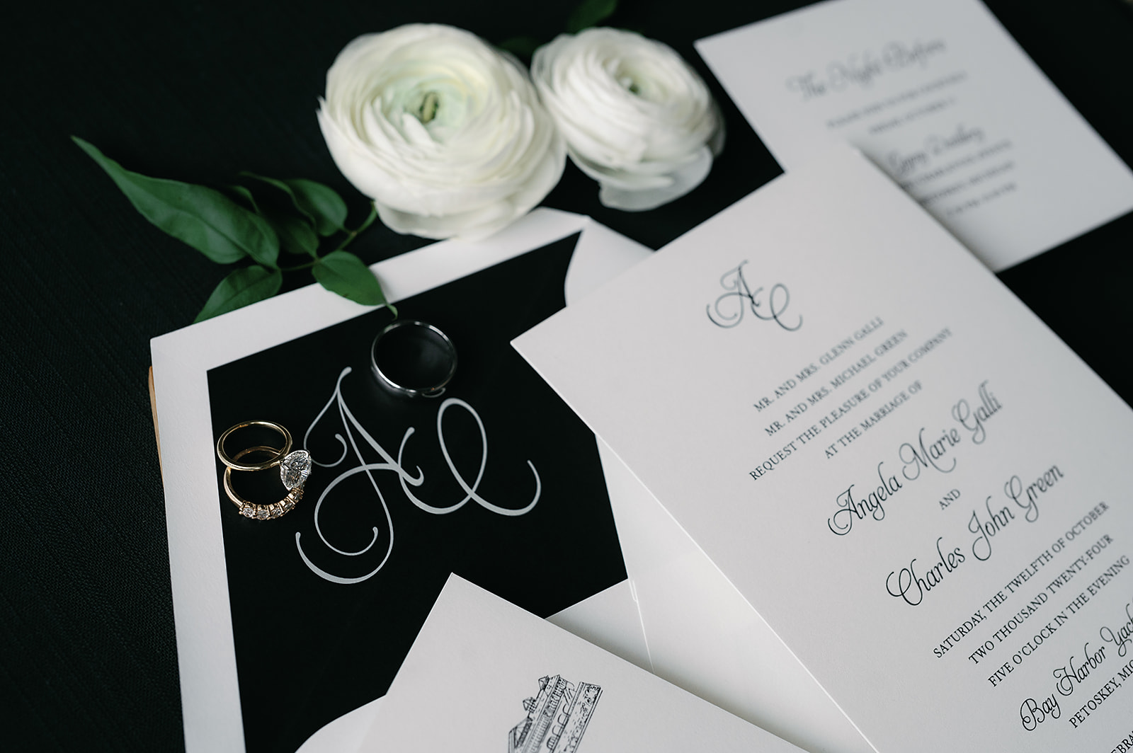 Wedding invitation suite with rings, florals, and stationery details before the Bay Harbor Yacht Club wedding.