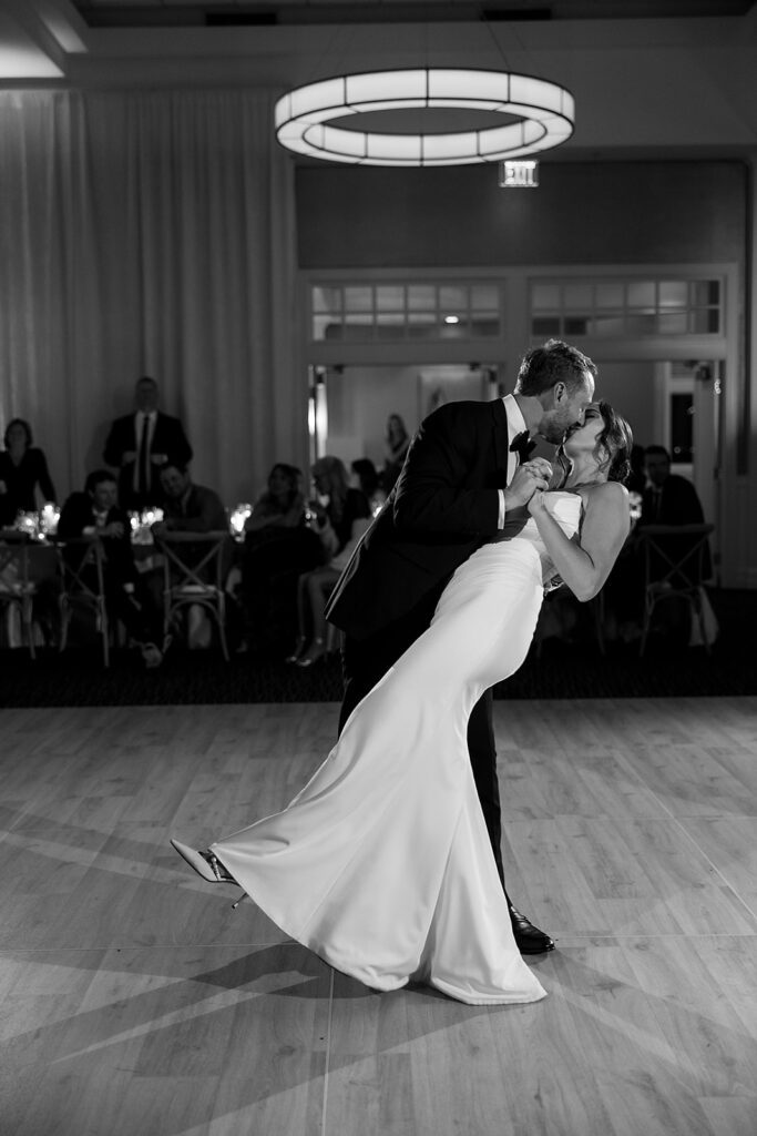 Bride and groom kissing during their first dance from their Bay Harbor Yacht Club wedding reception in Northern Michigan