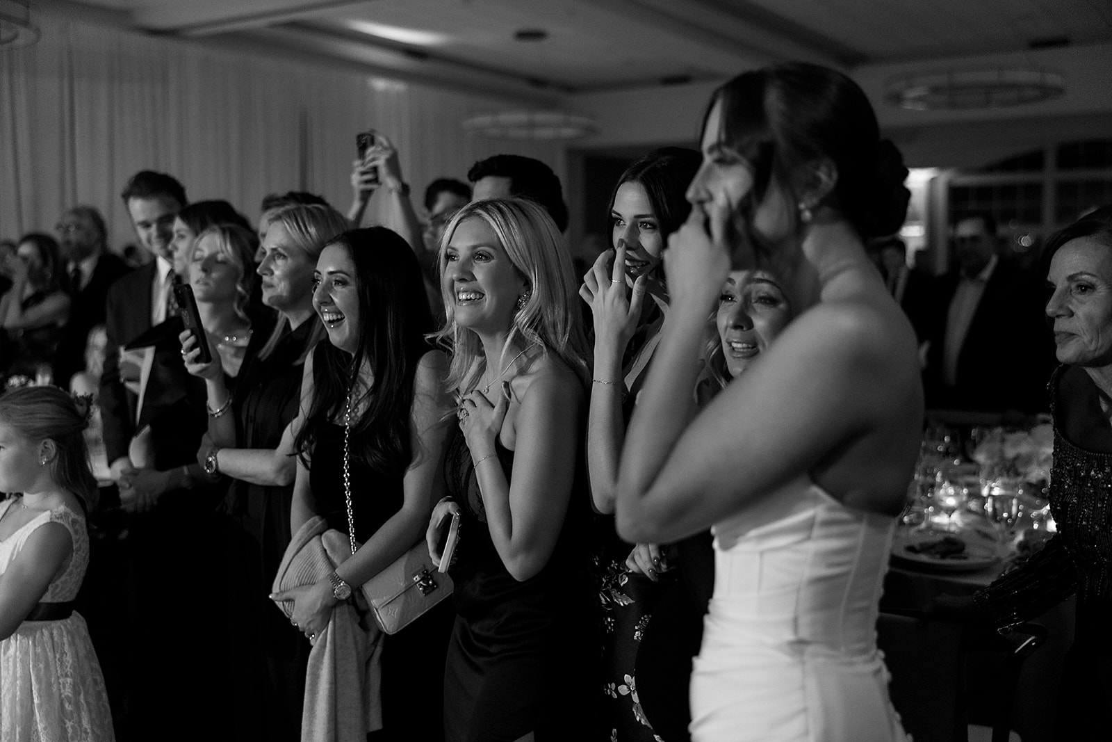 Black and white photo of guests watching the first dances
