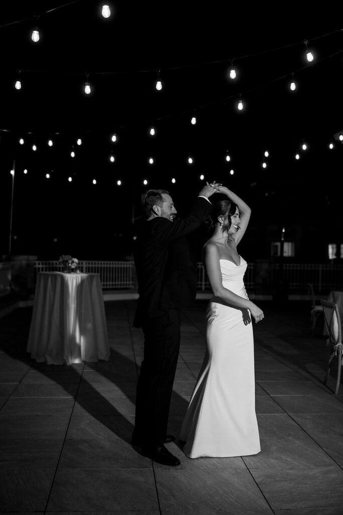 Black and white photo of a bride and groom sharing a last dance at Bay Harbor Yacht Club in Northern Michigan