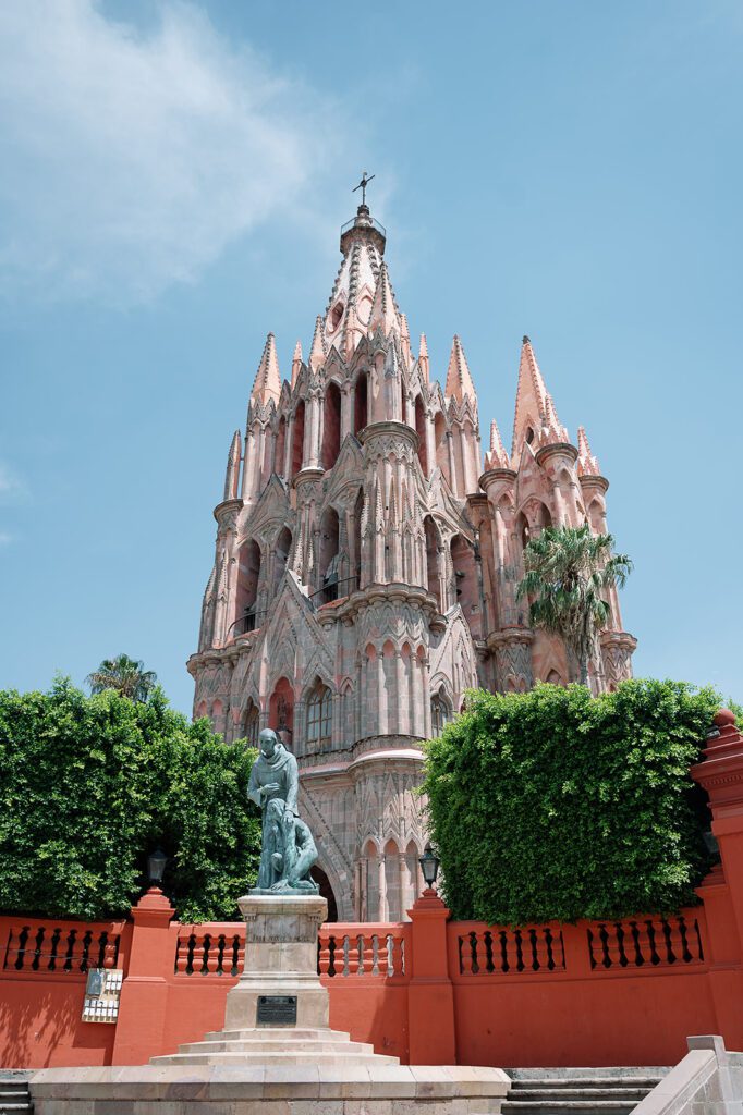 La Parroquia church in San Miguel de Allende under a bright blue sky.