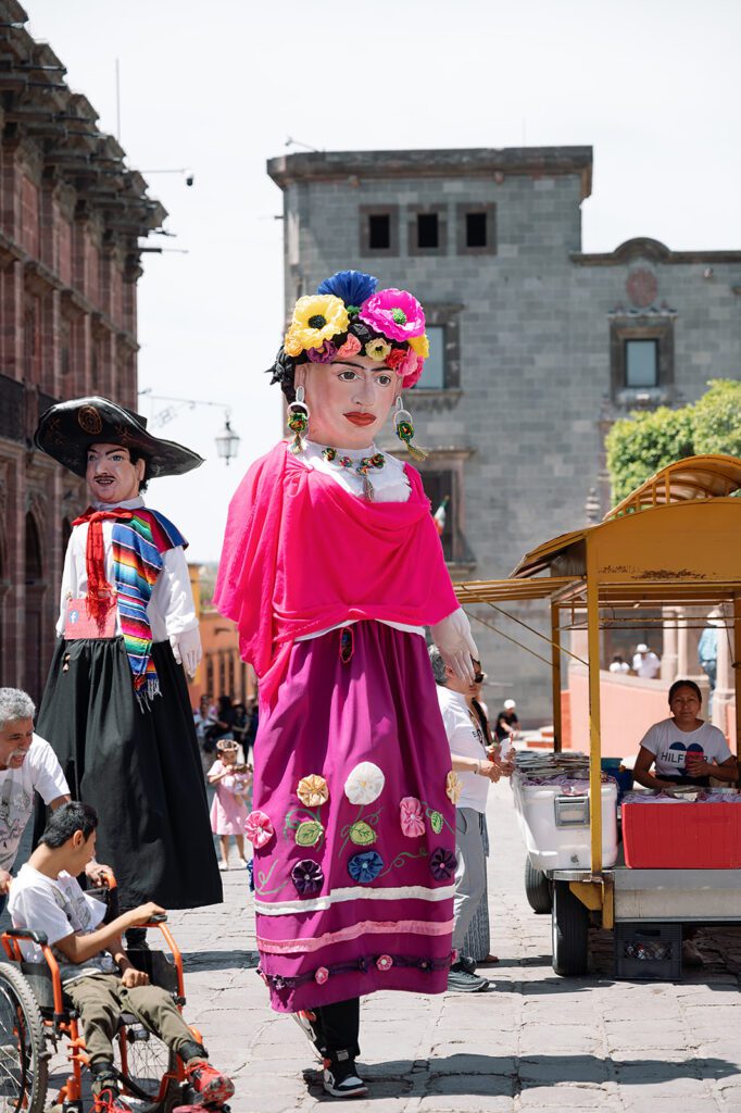 Traditional mojigangas dancing through the streets of San Miguel de Allende, adding color and joy to the farewell weekend.