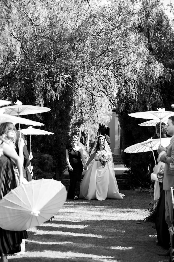 Bride walking down the aisle with her mother at Hacienda San Luis Gonzaga garden