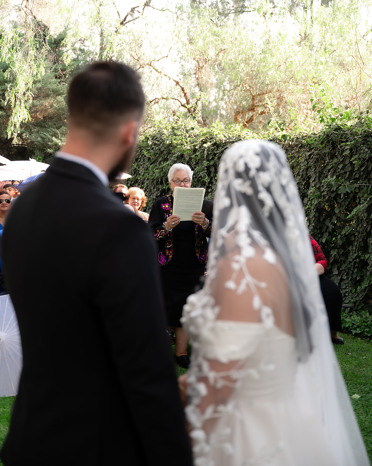 Brides grandmother giving a speech during their San Miguel de Allende wedding ceremony at Hacienda San Luis Gonzaga