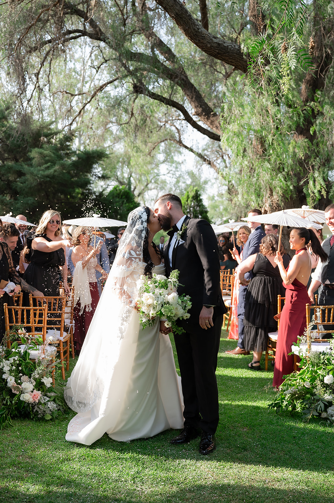 Bride and grooms end of aisle kiss as husband and wife during their hacienda san luis gonzaga san miguel de allende wedding ceremony