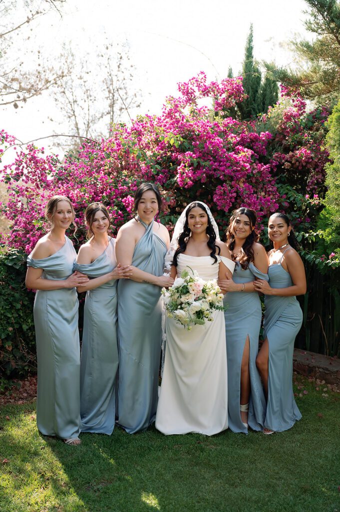 Bridesmaids in light blue dresses with bride at garden of Hacienda San Luis Gonzaga San Miguel de Allende wedding