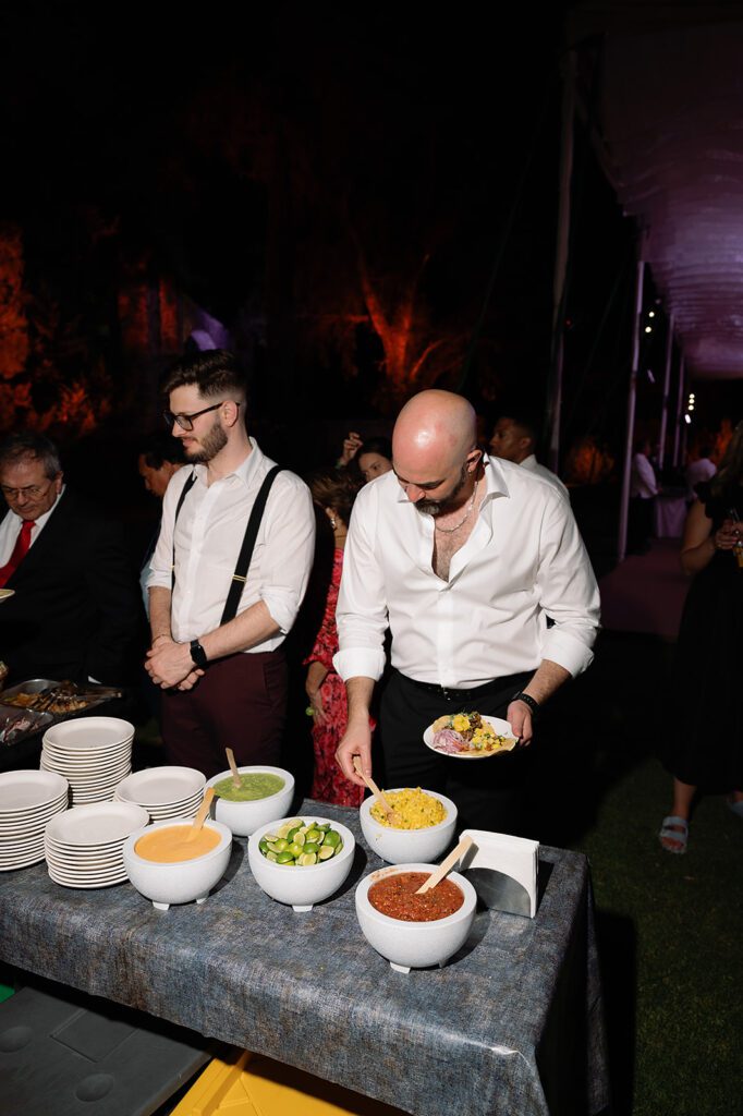 Late-night taco bar setup with assorted salsas and toppings during reception at Hacienda San Luis Gonzaga wedding in San Miguel de Allende.
