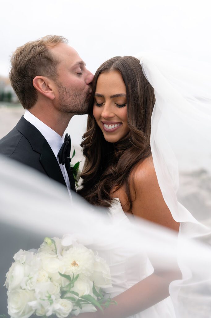 Close up bride and grooms portrait on the beach outside of Bay Harbor Yacht Club in Northern Michigan