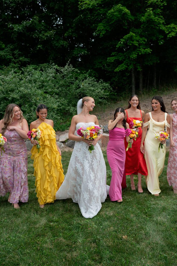 Outdoor bride and bridesmaids portraits at Noverr Farms in Traverse City, Michigan.