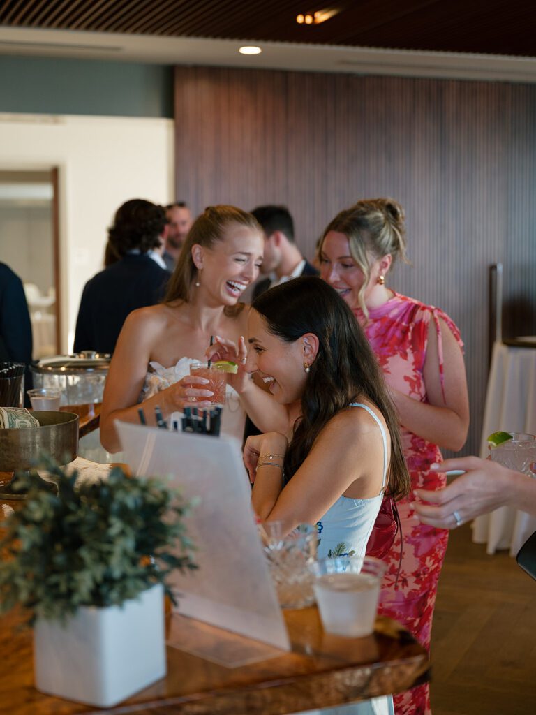 Wedding guests enjoying drinks and conversation on the Delamar terrace during a Traverse City wedding weekend.