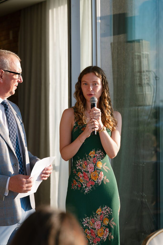 Guests giving speeches at the welcome party at a Delamar Traverse City welcome wedding weekend.