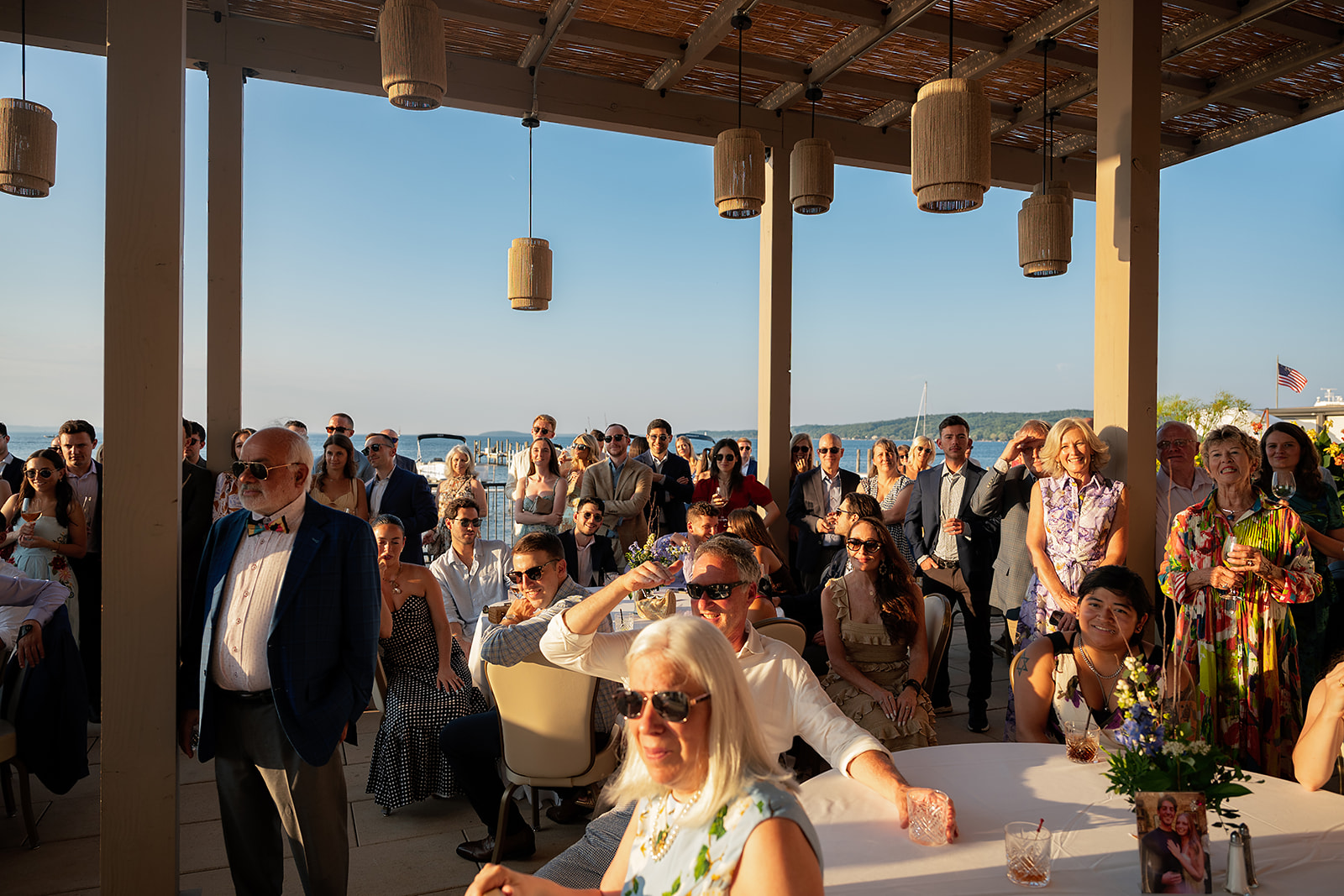 Golden hour wedding welcome party on the patio at The Delemar in Traverse City, Michigan.