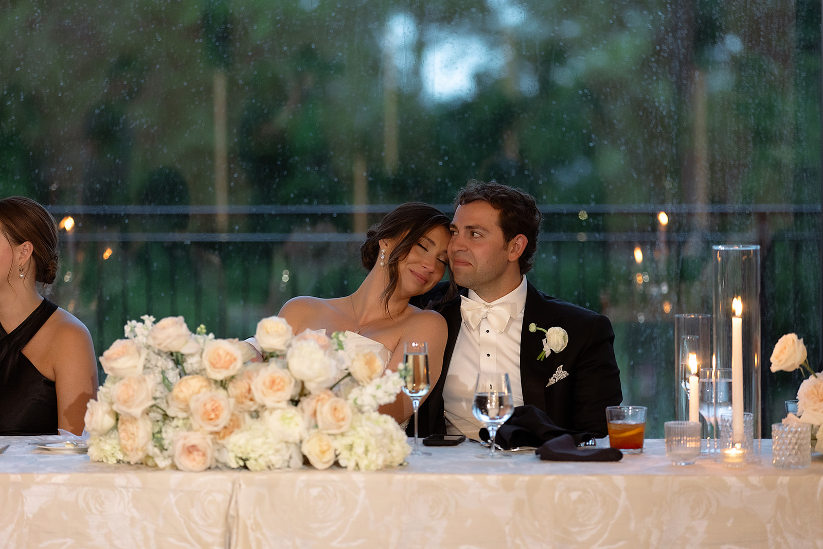 The couple seated at their sweetheart table during the Grosse Pointe War Memorial wedding reception.
