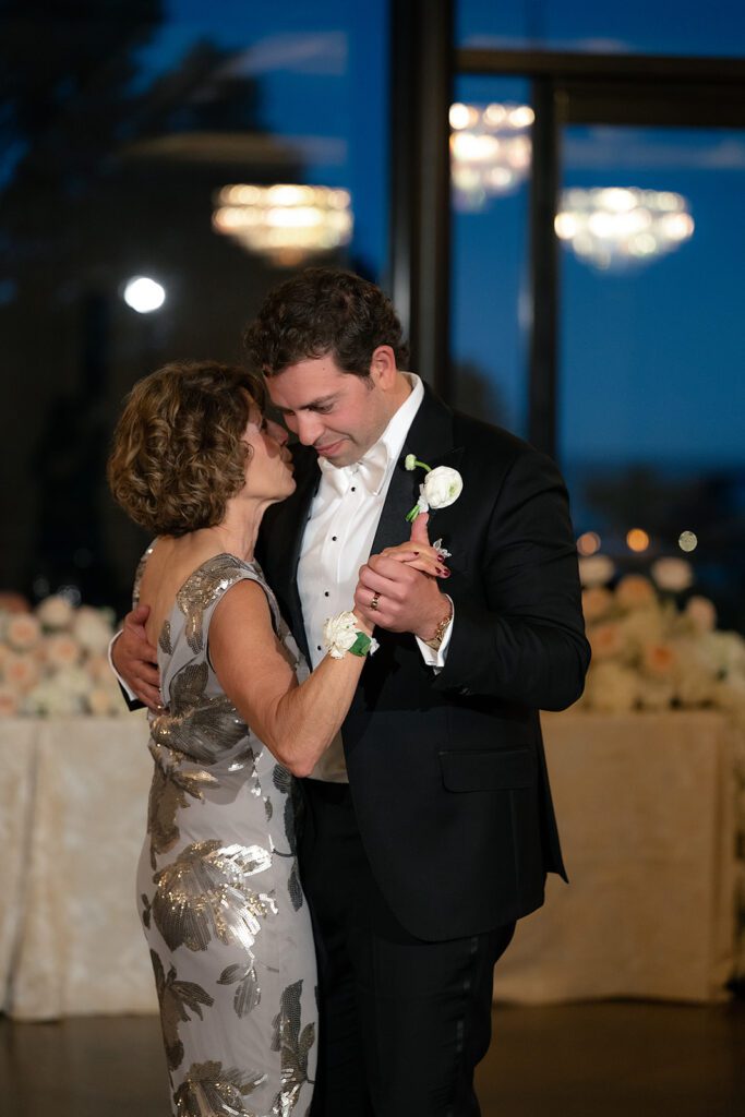 Groom sharing a dance with his mother.