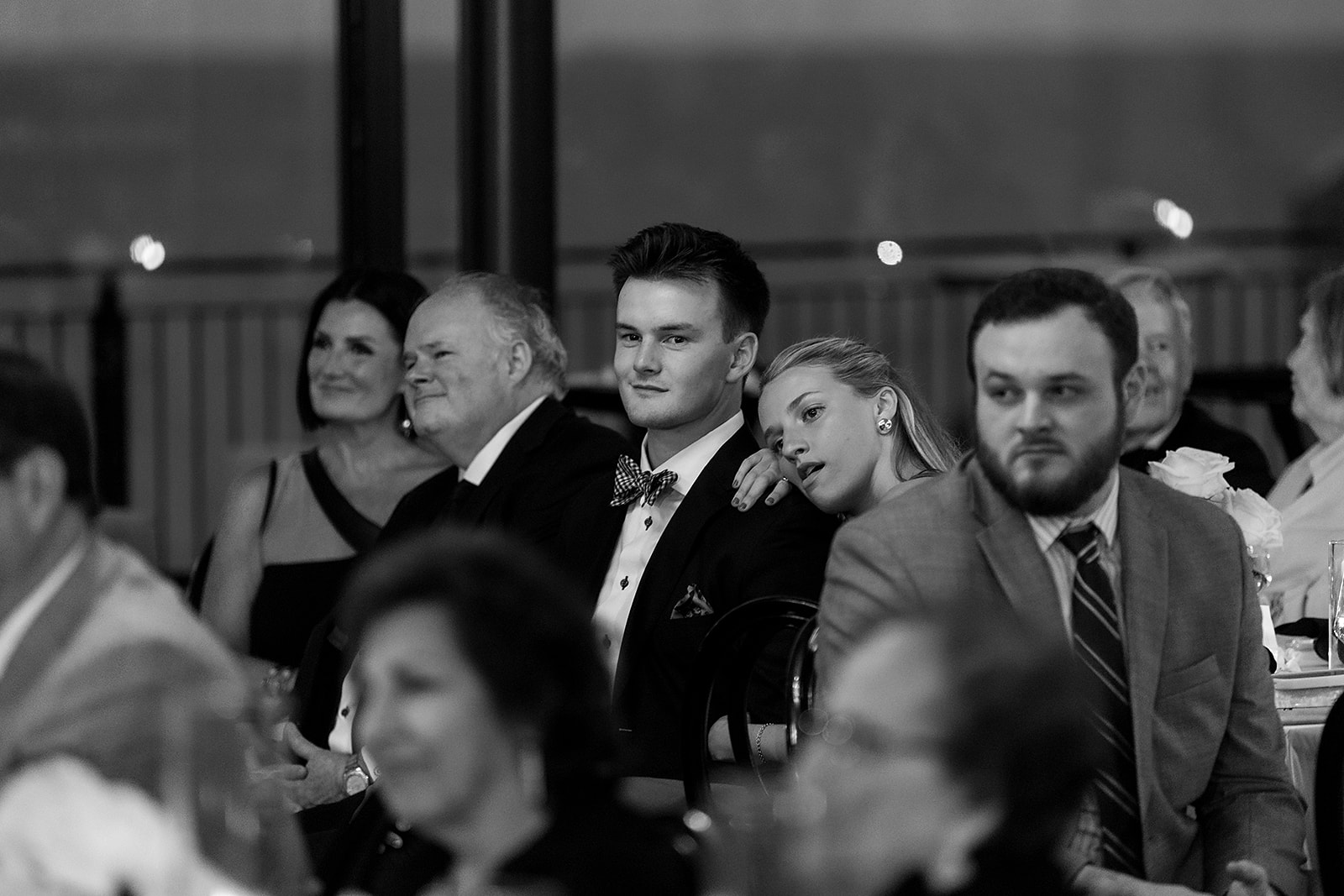 Black and white photo of guests watching the bride and groom dancing.