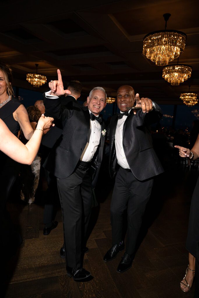 Guests dancing on the dance floor during a Grosse Pointe War Memorial wedding reception in the Ballroom.