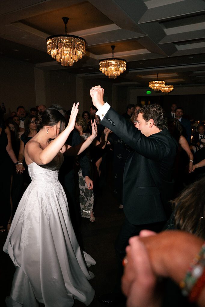 The couple dancing together on the ballroom dance floor at the Grosse Pointe War Memorial.