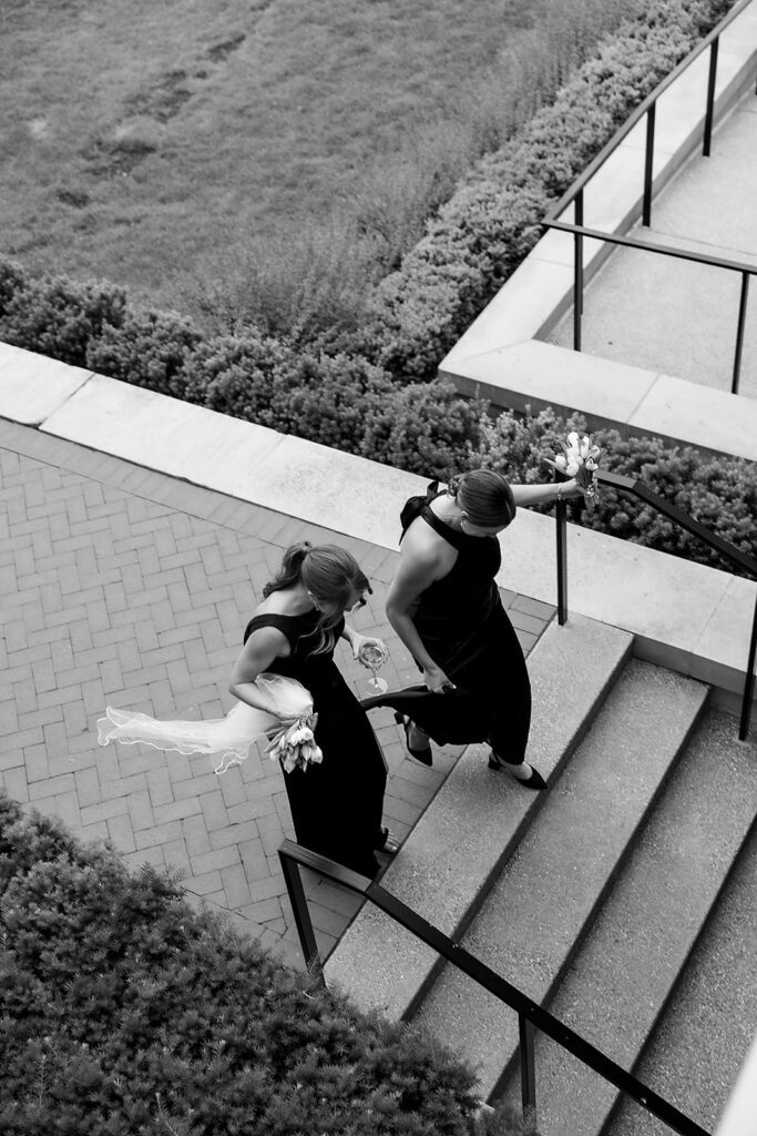Guests walking with drinks during cocktail hour.