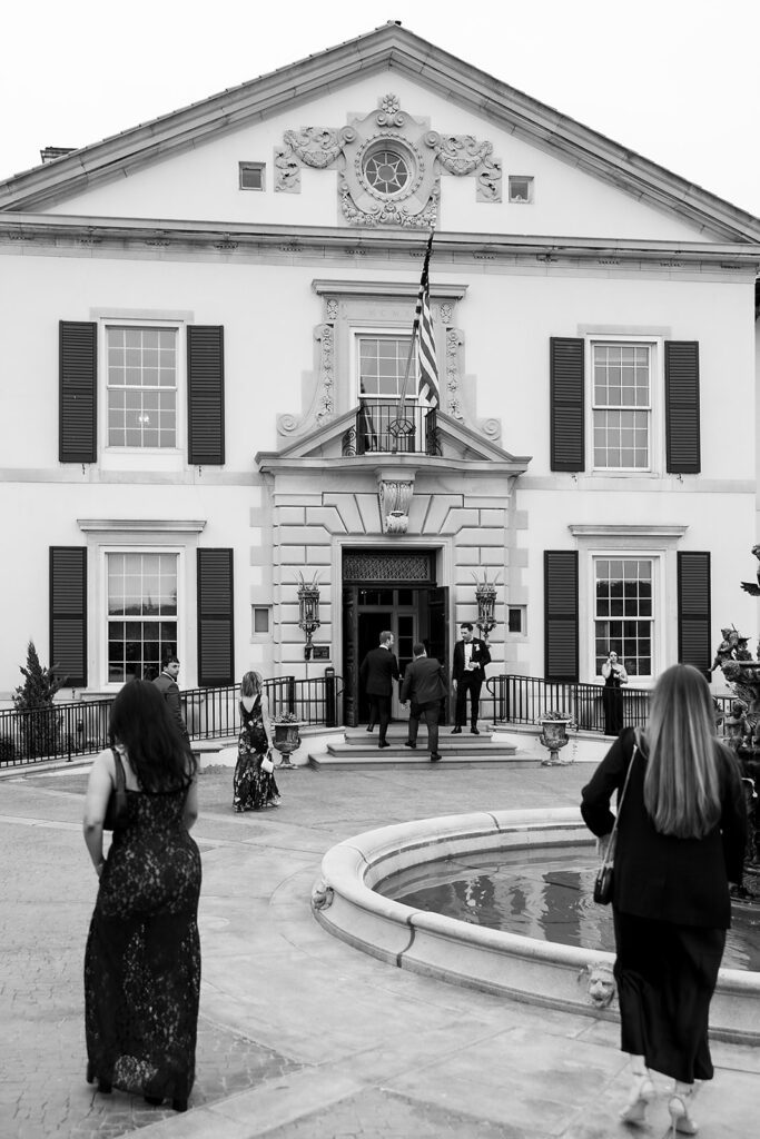 Black and white photo of guests arribing to Grosse Pointe War Memorial.