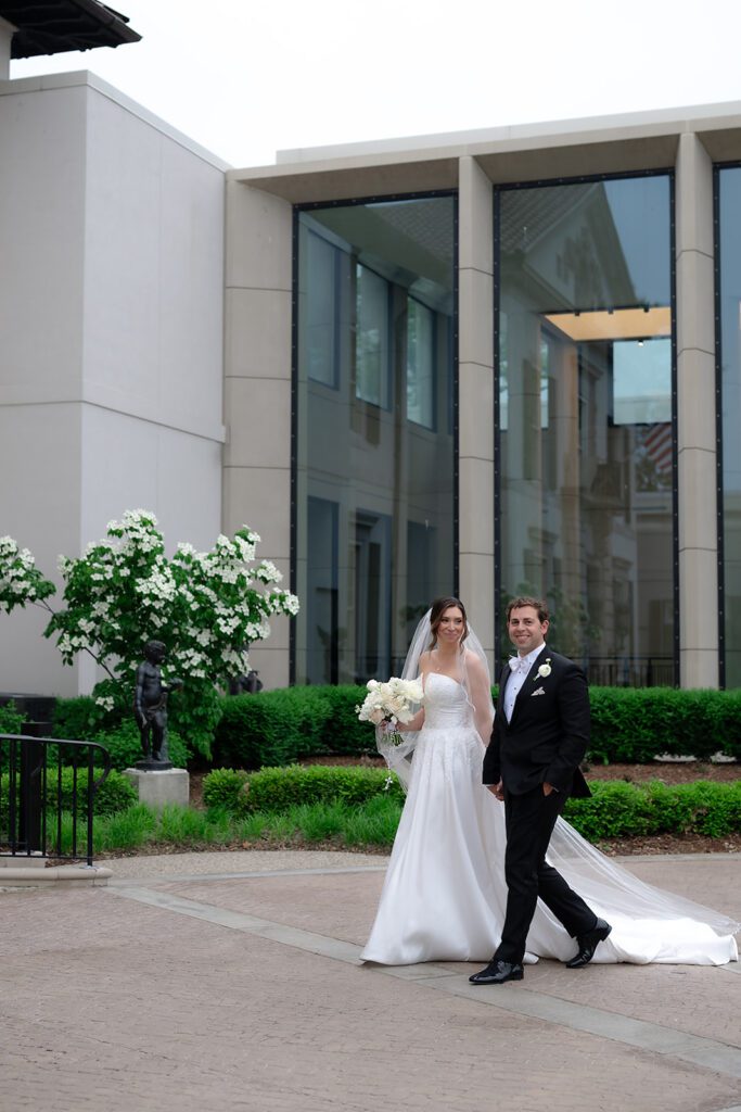 Couple walking together outside The War Memorial in Grosse Pointe Farms.