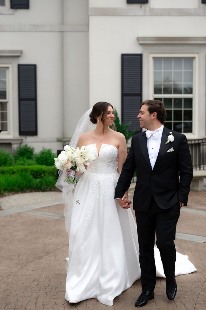 Couple walking together outside The War Memorial in Grosse Pointe Farms.
