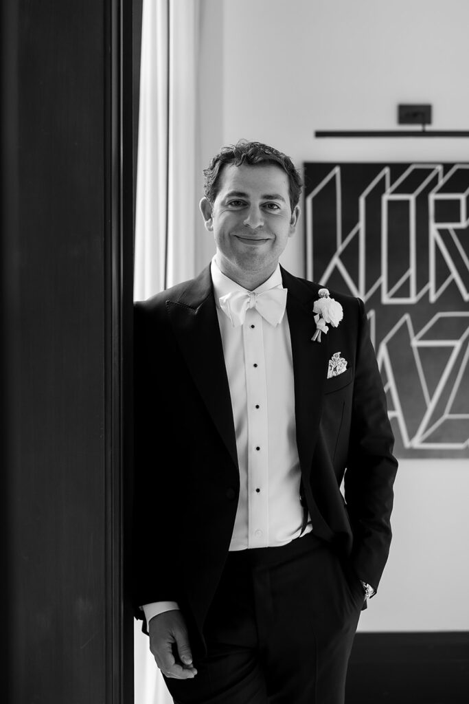 Groom portrait in a classic tuxedo during getting ready at the Shinola Hotel in downtown Detroit.