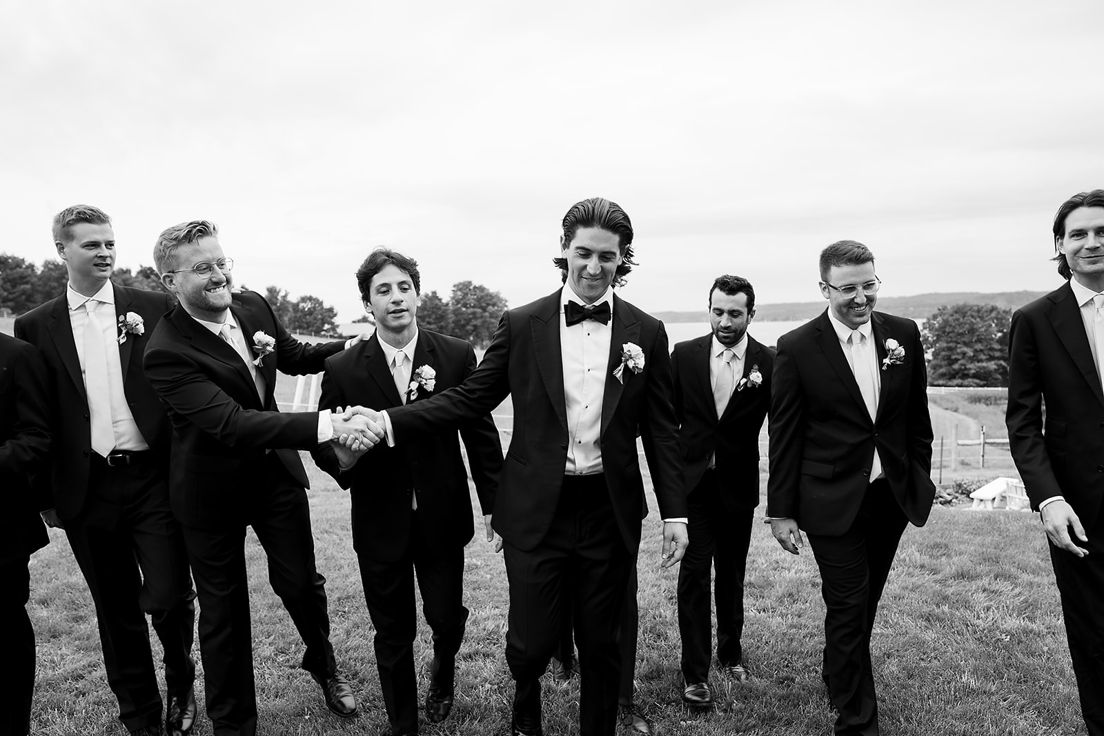 Black and white photo of the groom and groomsmen from a Noverr Farms wedding in Traverse City, Michigan.