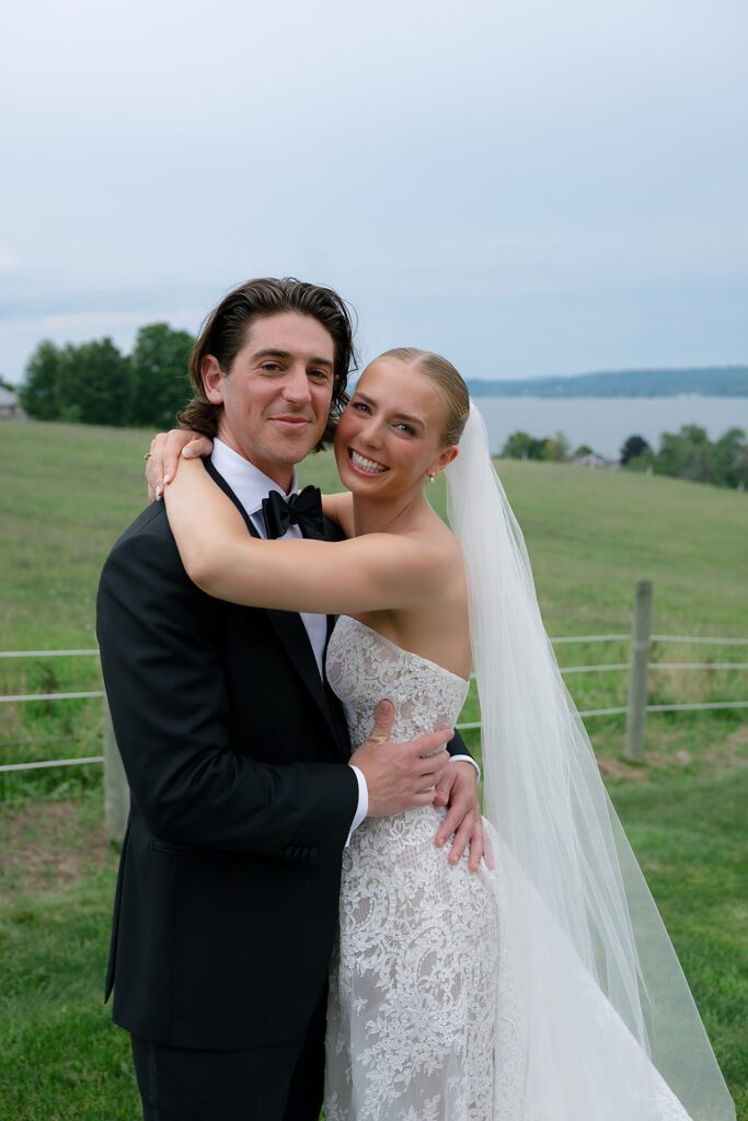 Bride and groom posing at Noverr Farms wedding venue in Traverse City, Michigan.