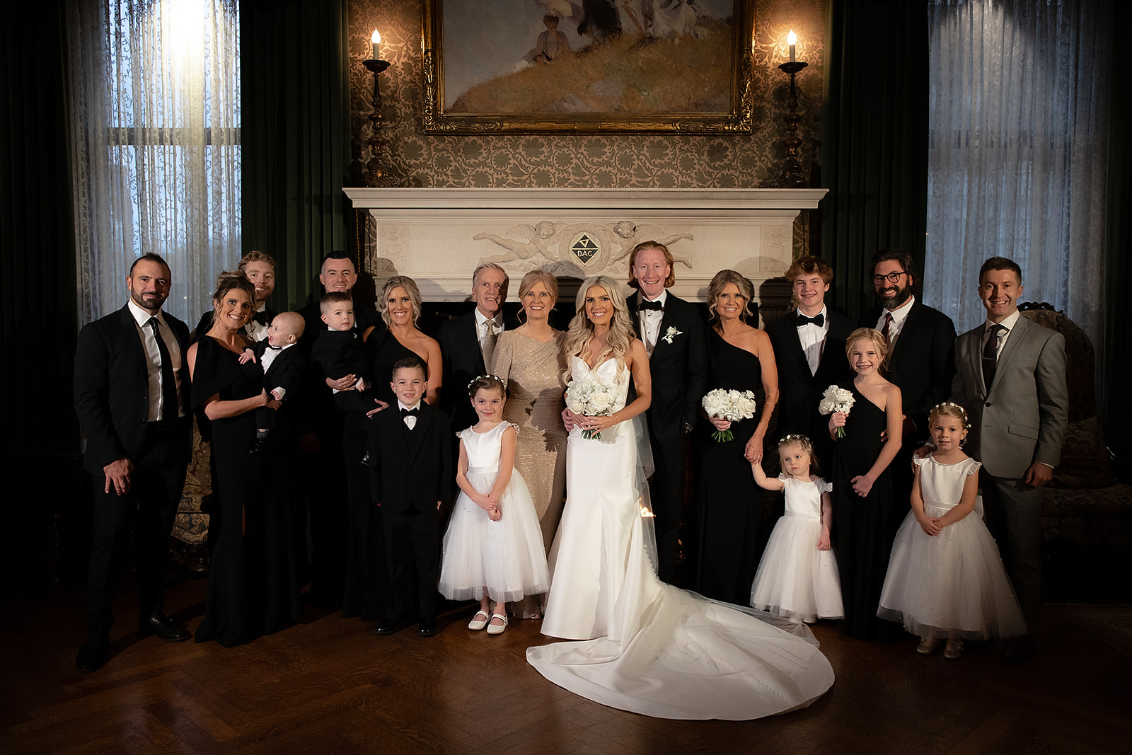 Indoor group family photo from a Detroit Athletic Club wedding.
